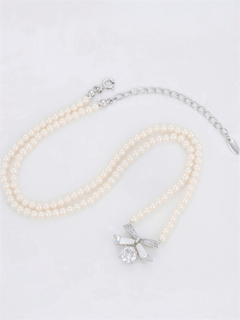 Pearl Necklace Platinum Plated Bow CZ Stone & Mallorca Pearl Adjustable